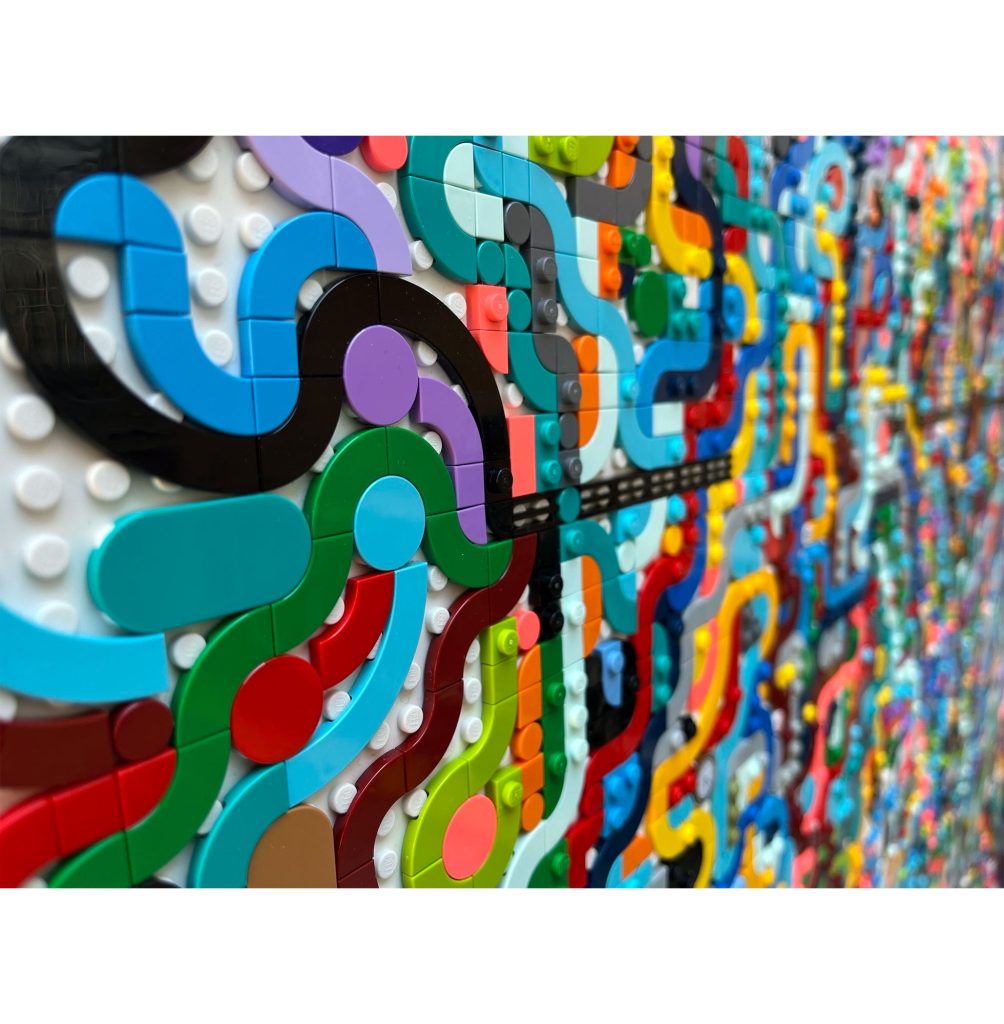 Jaye Moon Blowin’ in the Wind (detail), 2023 8000 Lego bricks on Dibond 40 x 40 x 1 inches